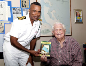 Capt. Tellis A. Bethel presents book The Lucayan Sea to Sir Durwood Knowles