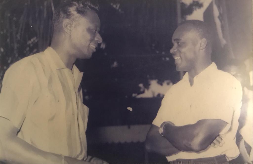 Singer Nat King Cole chatting with Duke Strachan